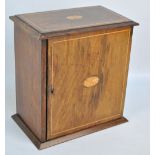 An Edwardian oak and inlaid smokers' cabinet with starburst decoration, width 27.5cm.