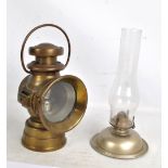 A Lucas 'King of the Road' brass carriage lamp, height 26cm, and paraffin lamp (2).