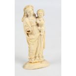 A 19th century French carved ivory small figure group of mother and child raised on oval plinth, (