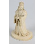 A late 19th century French carved ivory figure of a distinguished gentleman wearing elaborate