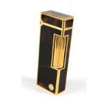 A Dunhill gold plated and tortoiseshell effect Rollagas lighter, height 6.5cm.