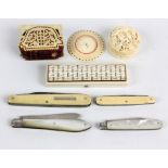 A group of ivory and bone items to include a late 19th century toothpick case with mirrored hinged