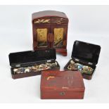 An early 20th century Japanese lacquered jewelry cabinet and three similarly decorated trinket boxes