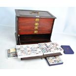 A Victorian mahogany collectors' cabinet with hinged fall front enclosing four shelves set with