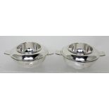 A pair of silver-plated circular twin-handled three-section dishes,