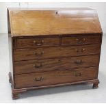A George III mahogany bureau with fitted interior, central cupboard flanked by Corinthian columns,