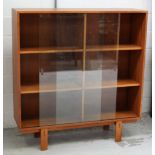 A modern bookshelf with twin glass doors, 129 x 122cm.