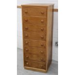 A modern pale oak chest of eight drawers, 135 x 53cm.