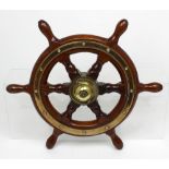 A good brass-mounted oak ship's wheel, the centre stamped for 'Simpson Lawrence', diameter 46.5cm.