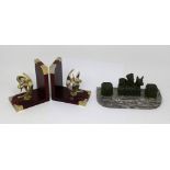 A pair of wooden bookends with plated mounts modelled as working propellers and a pen/ink stand.