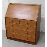 A modern teak Nathan bureau, the fall-front top with interior pigeonholes,