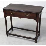 A late 18th century dark oak single-drawer hall table on plain turned legs to peripheral stretcher,