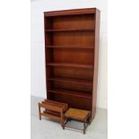 A mahogany four-shelf bookcase, a Lloyd Loom style basket,
