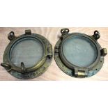 A pair of brass portholes with hinged doors and double screw fasteners, diameter 37.5cm.