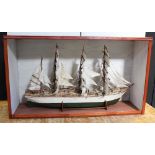 A scratch-built and hand-painted model ship with three mainsails and miniaturised detail throughout,