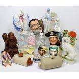 A quantity of ceramics to include figures, character jugs etc.