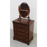 A reproduction mahogany chest of two short and three long drawers,
