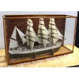 A scratch-built and hand-painted model ship with three mainsails and miniaturised detail including