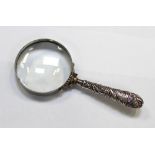 A magnifying glass with associated hallmarked silver handle, Birmingham.