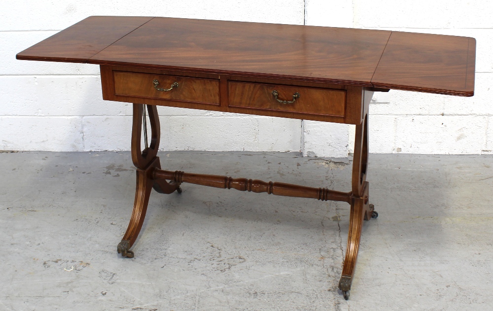 A reproduction drop-leaf side/hall table.