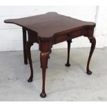 A mid-18th century mahogany two-leaf folding card and tea table with lobed corners,