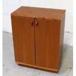 A teak cabinet with twin fold-out doors and internal shelving, storage, 78 x 60cm.