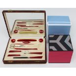 A cased manicure set (lacking one pair of scissors) and a boxed pink Wedgwood box (2).