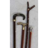 A malaca walking cane with hallmarked silver top,