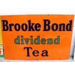 A vintage enamel advertising sign 'Brooke Bond dividend Tea', 50.5 x 76cm.