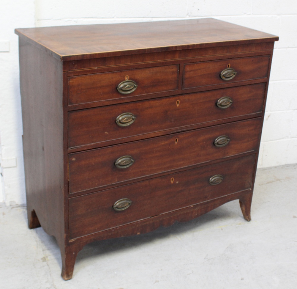 A George III mahogany cross-banded two-over-three chest of drawers with ebonised and boxwood