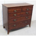 A George III mahogany cross-banded two-over-three chest of drawers with ebonised and boxwood