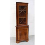 A reproduction yew wood corner cupboard, height approx 181cm.