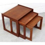 A nest of three teak tables, largest 41 x 54.5cm.