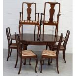 A Waring & Gillow oval mahogany dining table on cabriole legs to pad feet, with extra leaf,