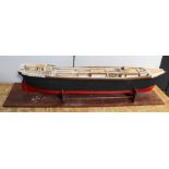 A scratch-built and hand-painted part-finished model ship, lacking sails,