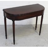 A George III mahogany fold-over card table with gate-leg support,