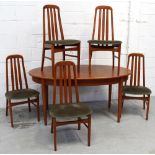 A retro G-Plan style oval dining table and a set of five matching slat-back tapering dining chairs