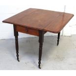 A Victoria mahogany Pembroke table on turned supports to castors, length when extended 91cm (af).