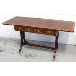 A reproduction mahogany sofa table with satinwood cross-banding, two frieze drawers to one side,