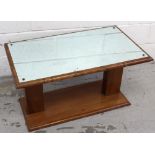 An Art Deco walnut rectangular coffee table with mirrored top, 86 x 50cm.