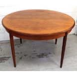 A retro extending circular dining table.