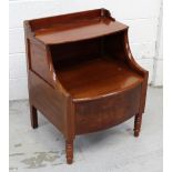 A Victorian mahogany commode with lift-up backrest, curving arms to turned supports, 77 x 61cm.