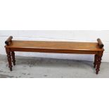 A William IV mahogany window seat on turned supports to tapering feet, length 147cm.