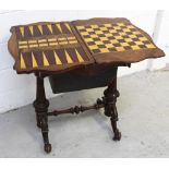 A late Victorian walnut folding games table, burr walnut veneered twists open to a chess board,