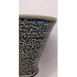 Rebecca Harvey; a soda fired stoneware beaker with mottled blue glaze, height approx 10cm.