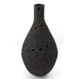 Louise Waller; a black grogged stoneware hand-built vase with pierced decoration,