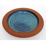 Dave Backhouse; a large earthenware blue glazed platter, diameter approx 30.5cm.