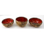 SherriffClay; a trio of hand-built bowls with carved relief figural decoration, glazed red interior,