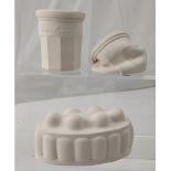 Sue Goldschmidt; a trio of slip cast blanc de chine forms, 'Jelly', length approx 12cm,