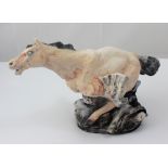 Katherine Dereli; a figural stoneware sculpture of a winged horse on stylised wave base,